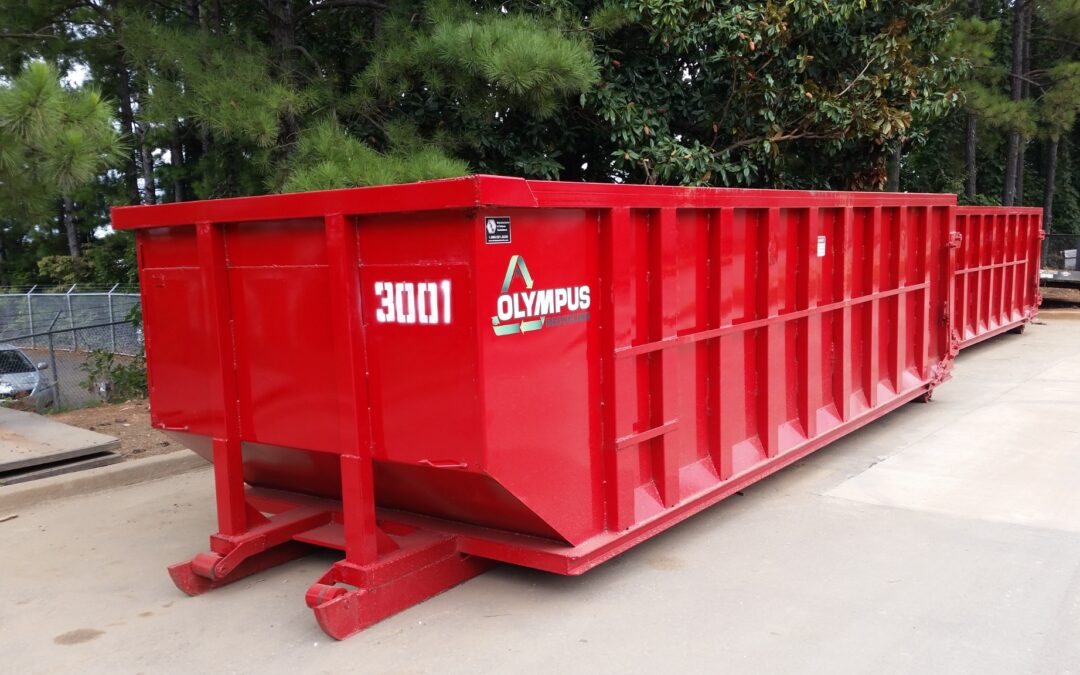 Red Olympus Recycling roll-off dumpster available for construction debris and waste removal.